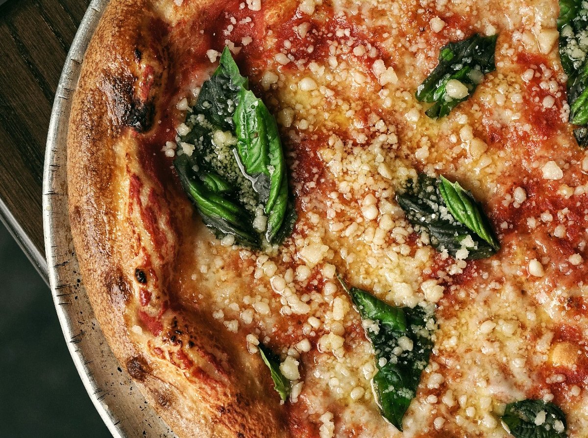 Fresh Margherita pizza with basil made in a Baking Social class