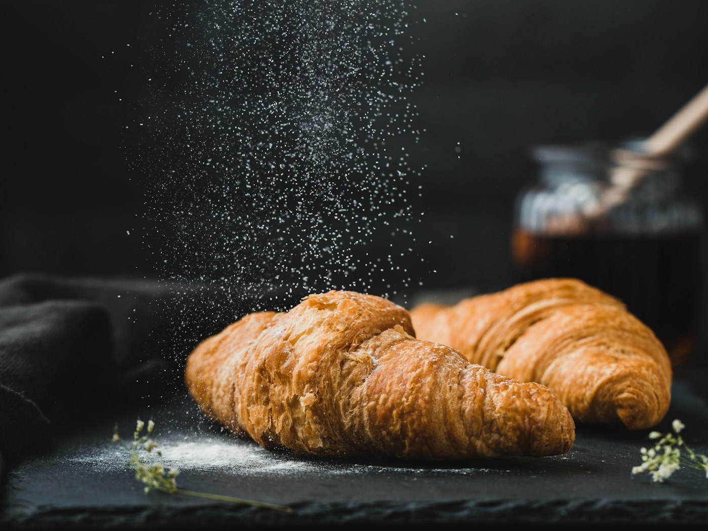 Croissants dusted with powdered sugar at Shane's Bakery