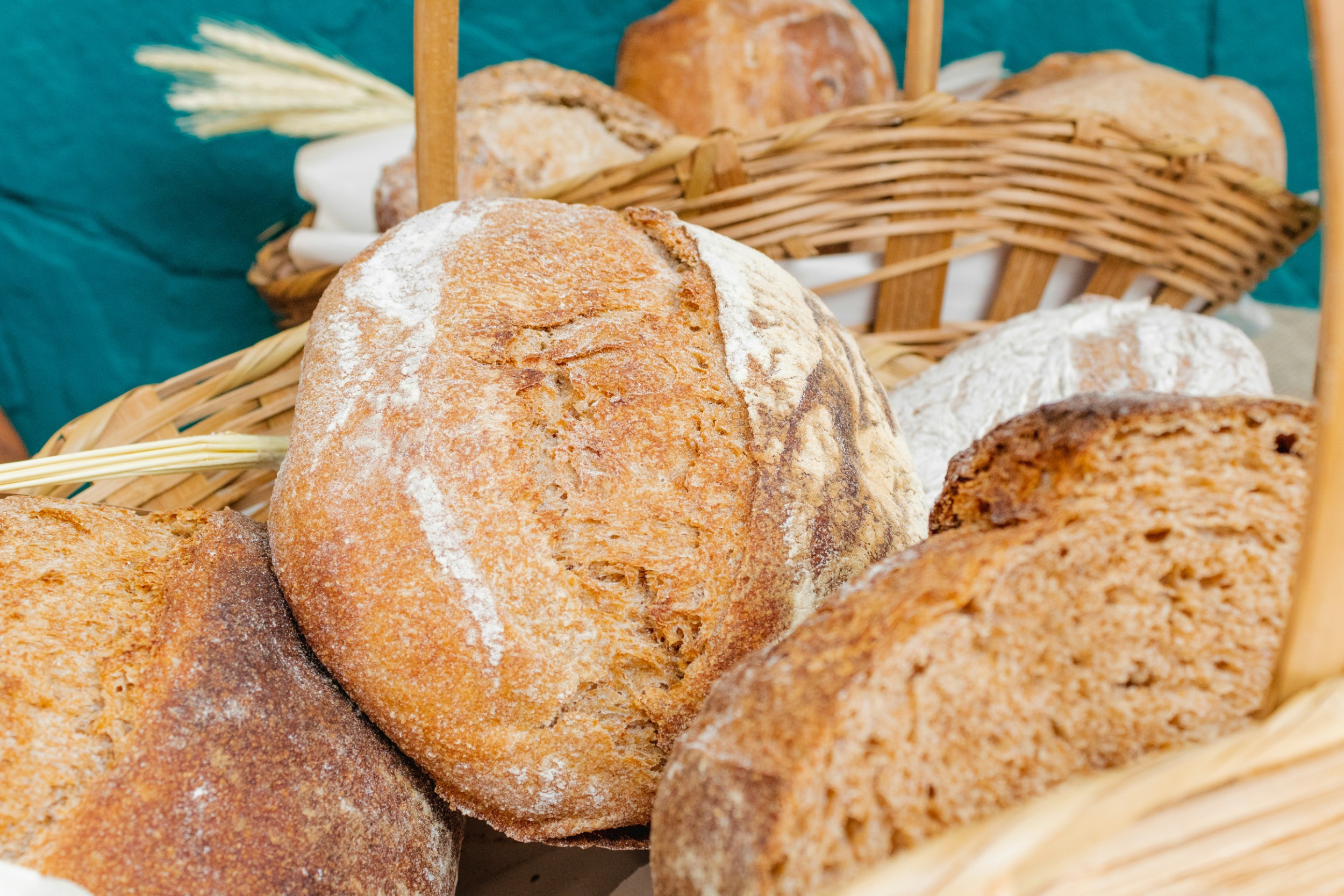 Basket of rustic sourdough bread from a bread baking class